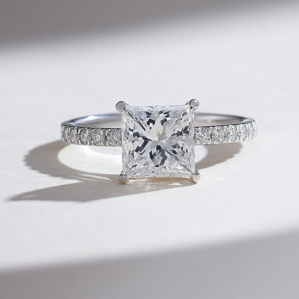 Front view of the Radiant Glory 2 Ct Princess Solitaire Ring in platinum with a pavé diamond band.