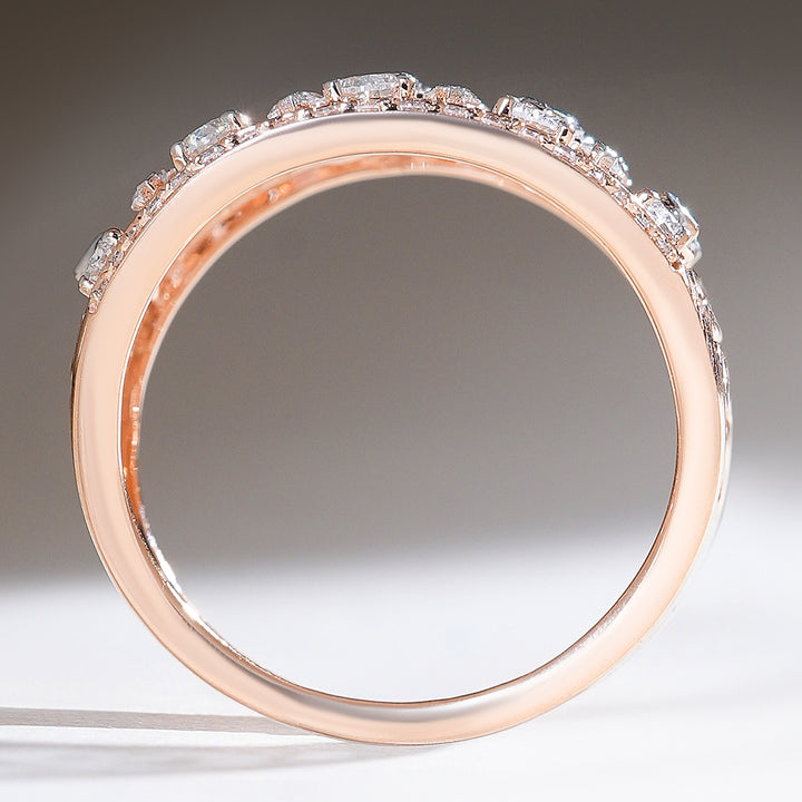 Side profile of the Raindrop Cocktail Ring showing the curved rose gold band with pavé-set diamonds along the top.