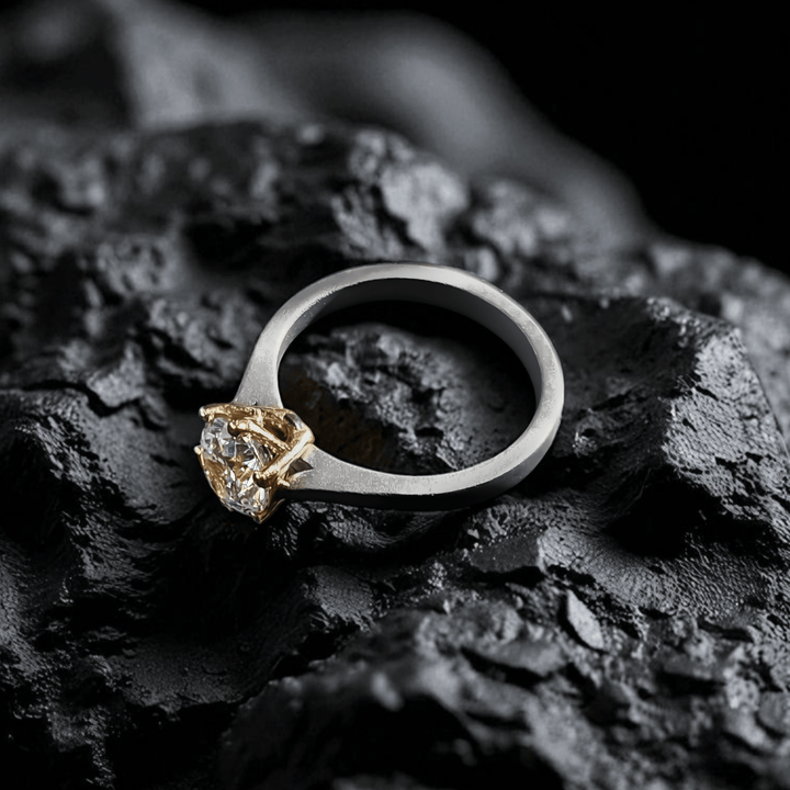 Side view of 1 Ct Regal Titanium Ring showing solitaire diamond in gold prongs.