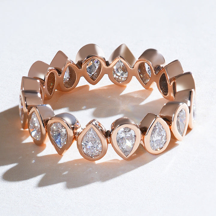 Top view of the rose gold reverse pear eternity band showcasing continuous pear-shaped diamonds.