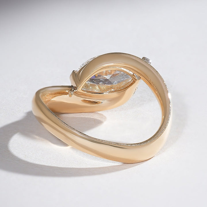 Back view of 18K yellow gold marquise solitaire ring with an open sweeping band design for a contemporary look.