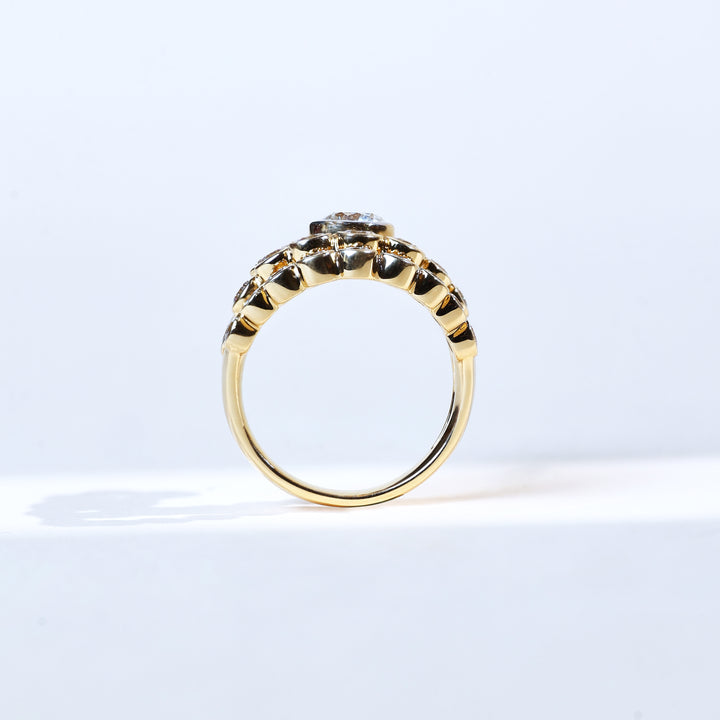 Side profile of 3 ct round ray diamond ring in yellow gold