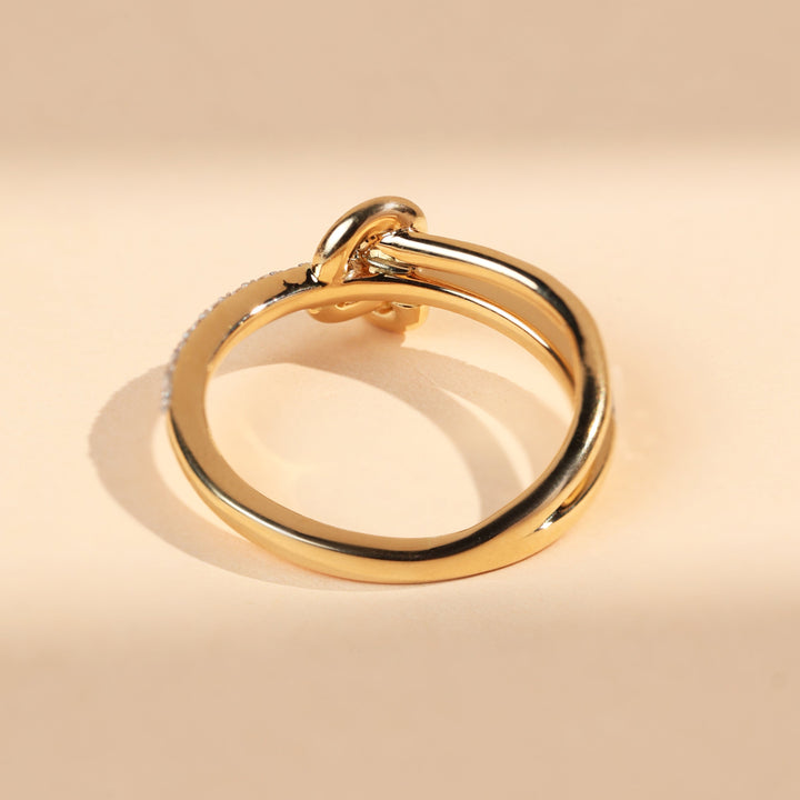 Back view of Sacred Knots Promise Ring in polished yellow gold, highlighting smooth finish.
