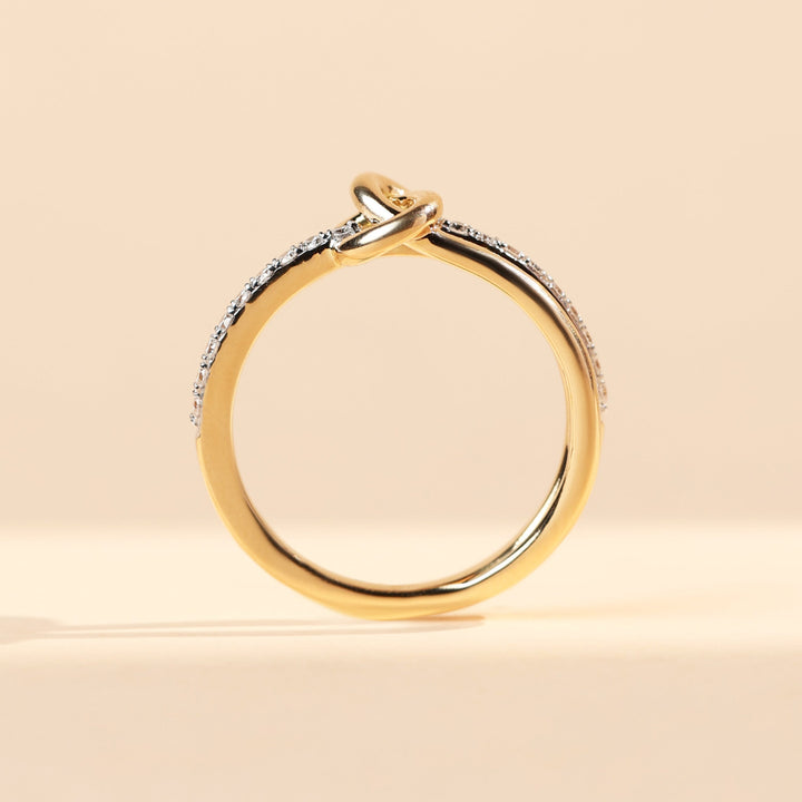 Side profile of Sacred Knots Promise Ring with elegant knot design and pavé diamonds