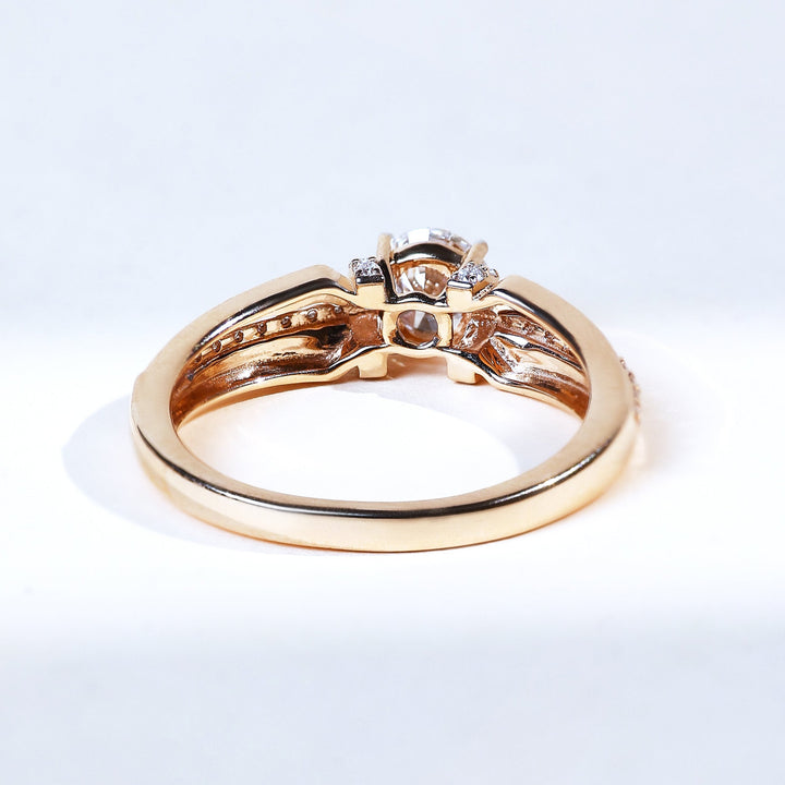 Back view of Signature T yellow gold solitaire ring with 0.5 ct round diamond