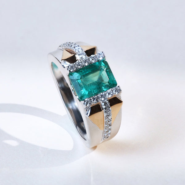 Signature T Green Radiance cocktail ring with emerald-cut green gemstone and diamond accents in two-tone gold