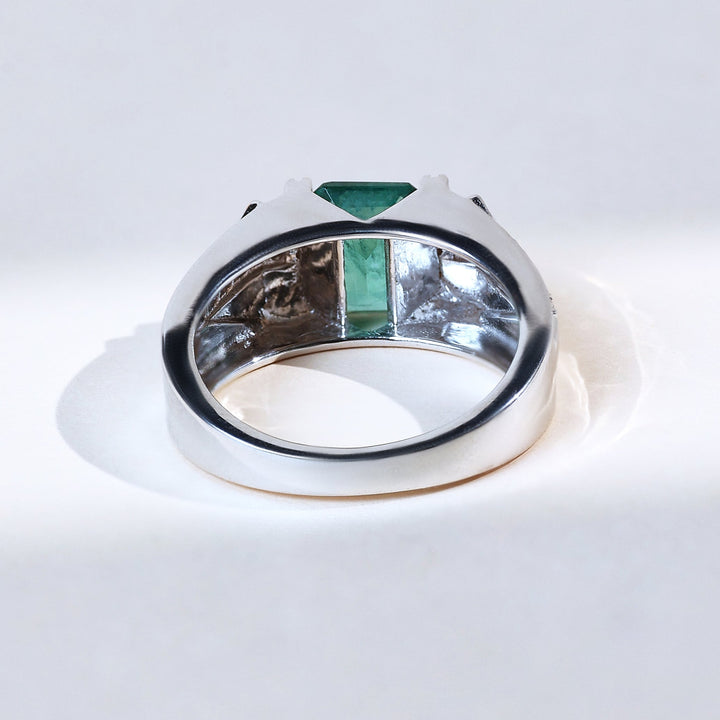Back view of Signature T Green Radiance cocktail ring with emerald-cut green center stone