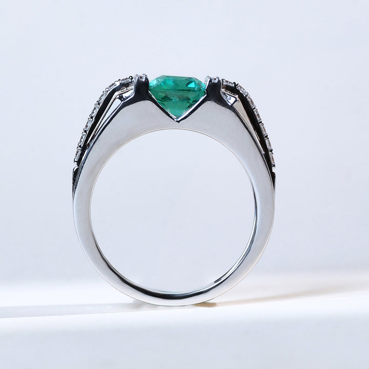 Side profile of Signature T Green Radiance emerald-cut gemstone ring in two-tone gold