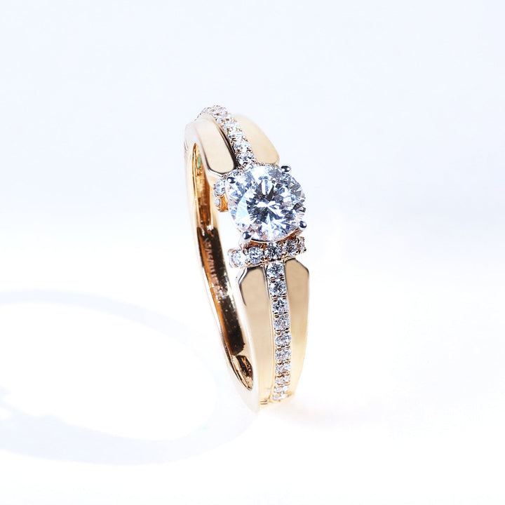 Angled view of Signature T 0.5 ct diamond solitaire ring with pavé-set band
