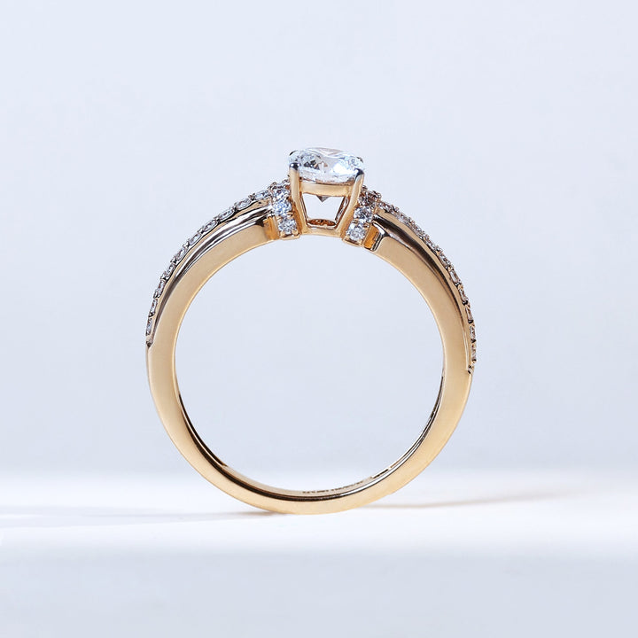 Side profile of Signature T 0.5 ct solitaire diamond ring in yellow gold