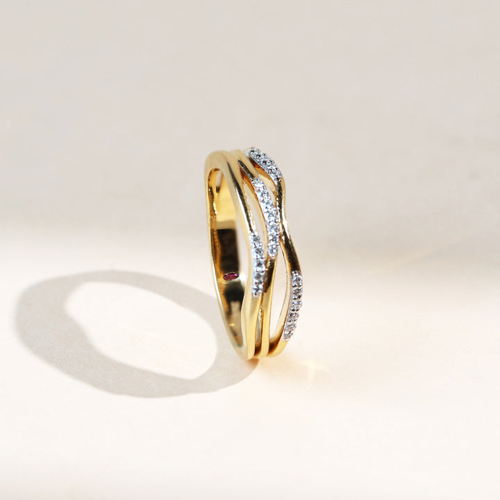 Angled side view of Sparkle in Waves Dailywear Ring showcasing interwoven diamond-set bands.