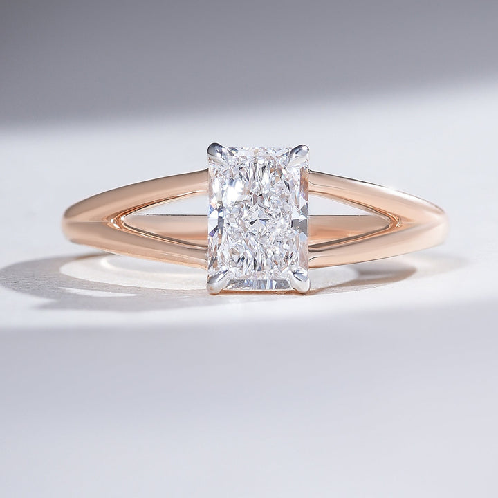 Front view of the Split Shank 1 Ct Radiant Solitaire Ring in rose gold with a radiant-cut diamond.