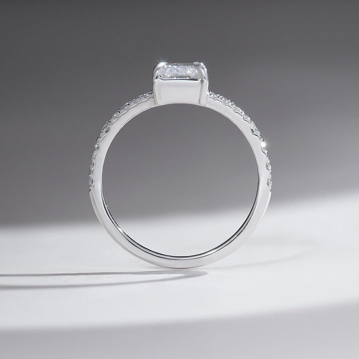Profile view of split shank pave solitaire ring showcasing 1 carat radiant diamond in platinum.