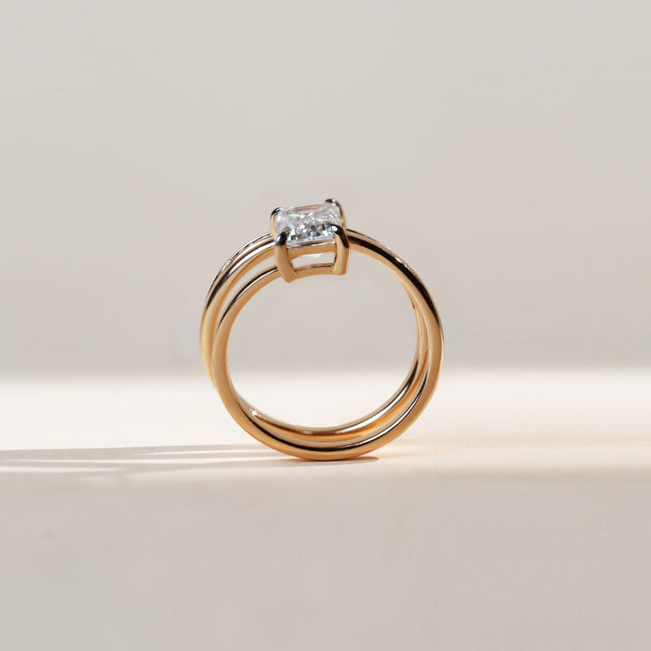 Side profile of Spring and Light Cocktail Ring highlighting the elevated emerald-cut solitaire.