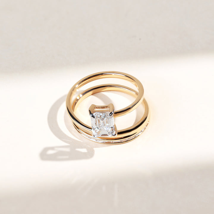 Top view of Spring and Light Cocktail Ring showing emerald-cut solitaire on double gold bands.