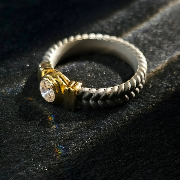 Close-up of Stonecrest Titanium Ring with solitaire diamond and detailed titanium rope band