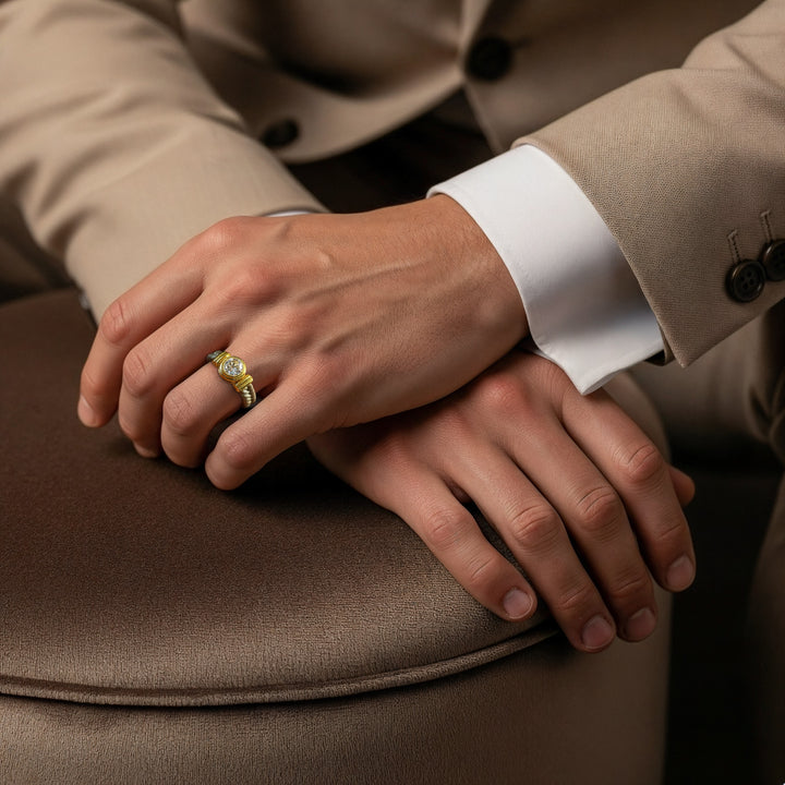 Man wearing Stonecrest Titanium Ring with gold bezel solitaire and rope-detailed titanium band.
