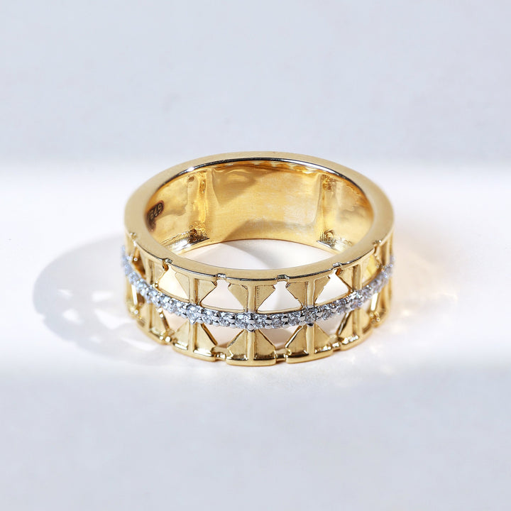 Side profile showcasing geometric shield cut-outs with diamond row.