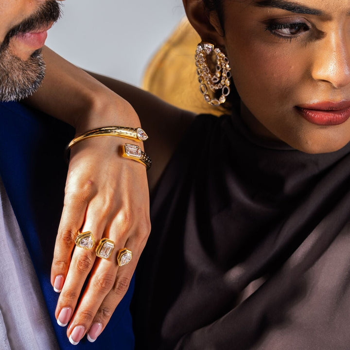 Lifestyle image of Three Lovers Cocktail Ring worn with a matching diamond cuff.
