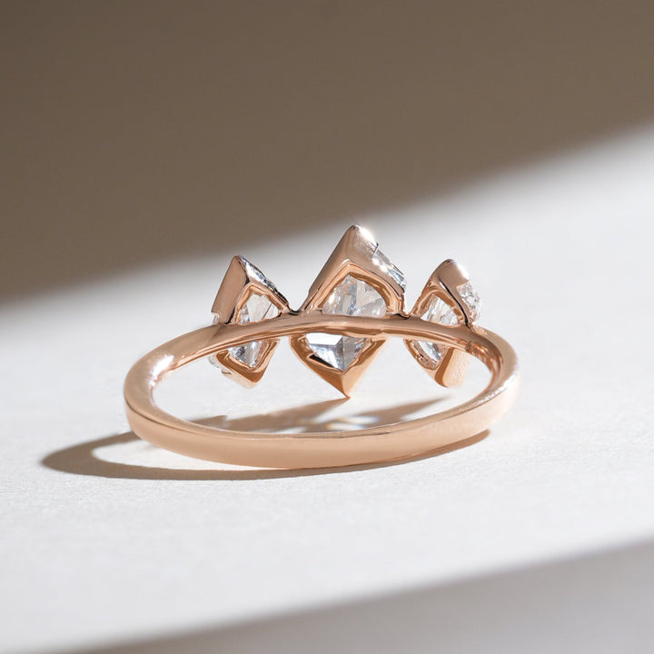 Back view of the Triad Spark ring highlighting open gallery work and alignment of three radiant stones