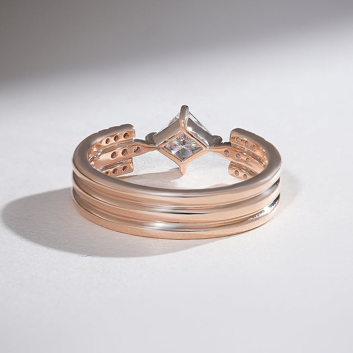 Back view of rose gold triple-band ring with open setting showcasing the princess-cut diamond.
