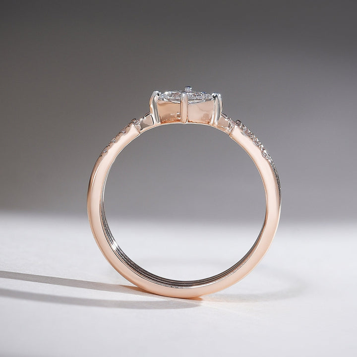 Top profile of rose gold triple-band ring with pavé diamond accents framing a central princess-cut diamond.