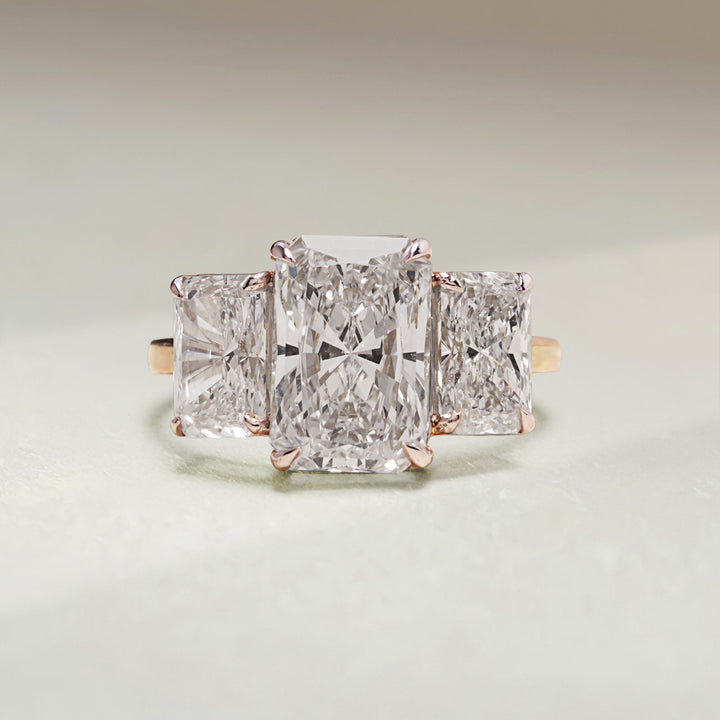 Front view of Triple Radiance 5 Ct Three Stone Ring in yellow gold with rectangular diamonds