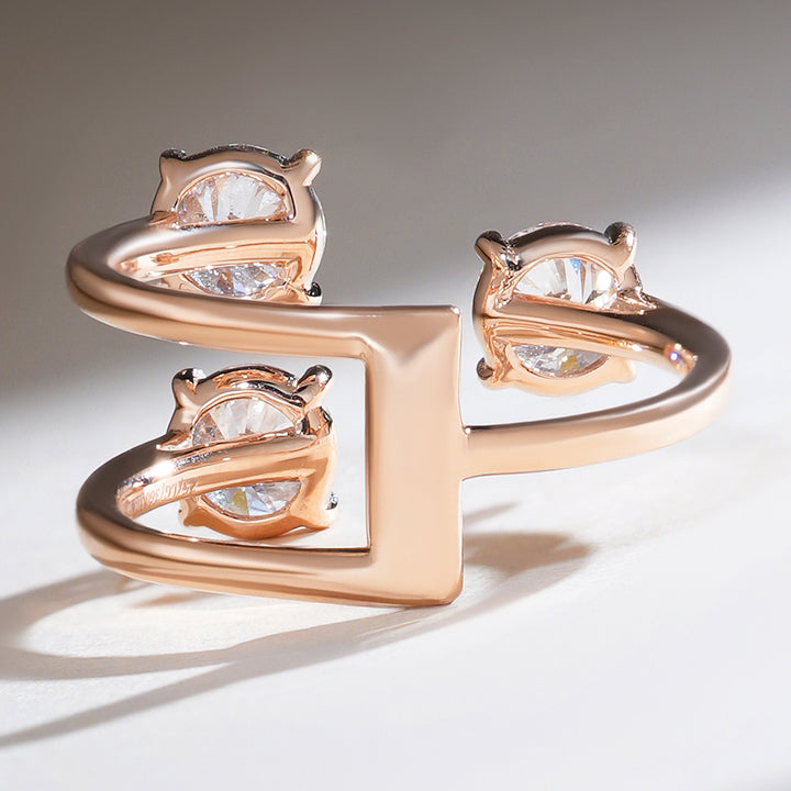 Back view of triple solitaire diamond ring with open gallery design for light reflection