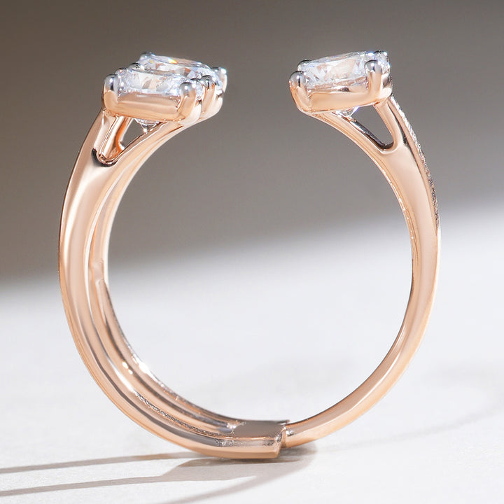 Profile shot of triple solitaire diamond ring highlighting curved band and raised diamond setting