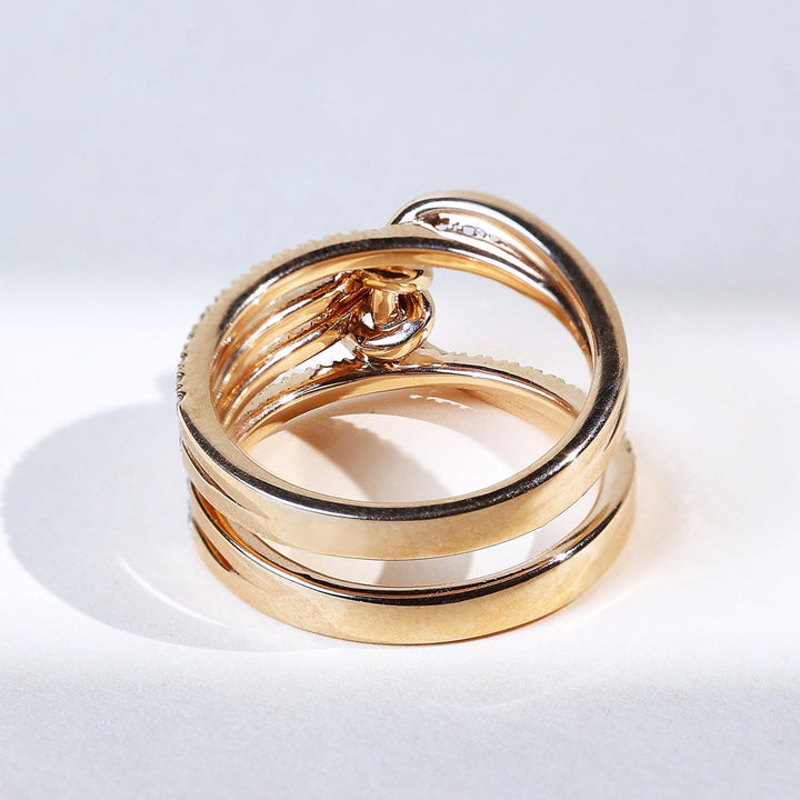 Rear view of Twisted Knot Promise Ring showing sleek gold bands.