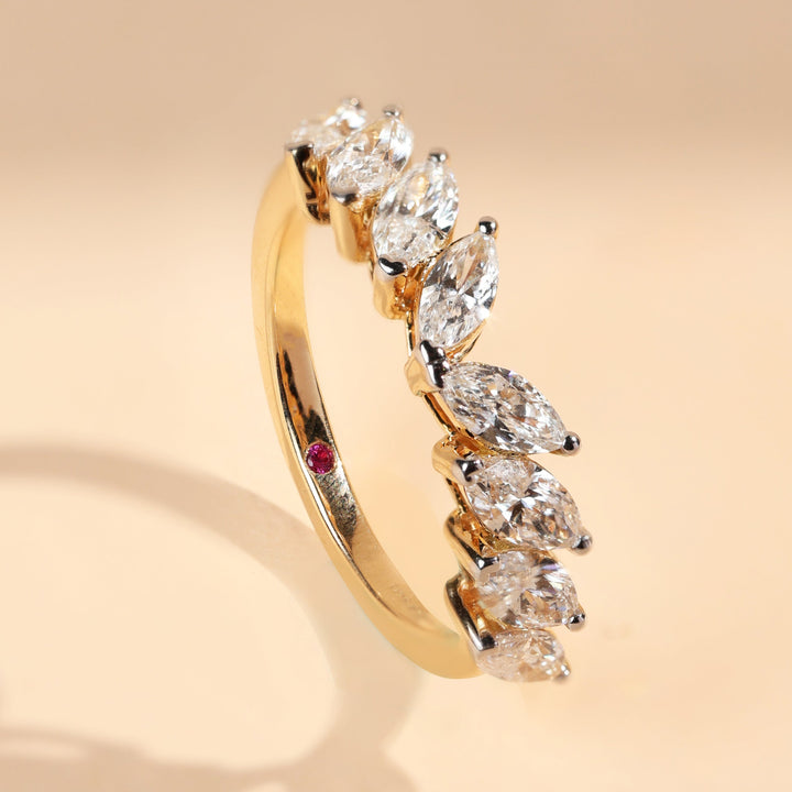Angled side view of Two Ways Promise Ring with marquise diamonds in yellow gold.