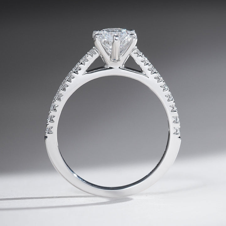 Side profile of the Everlasting Love Round Solitaire Ring showcasing the raised solitaire setting and diamond-studded band.