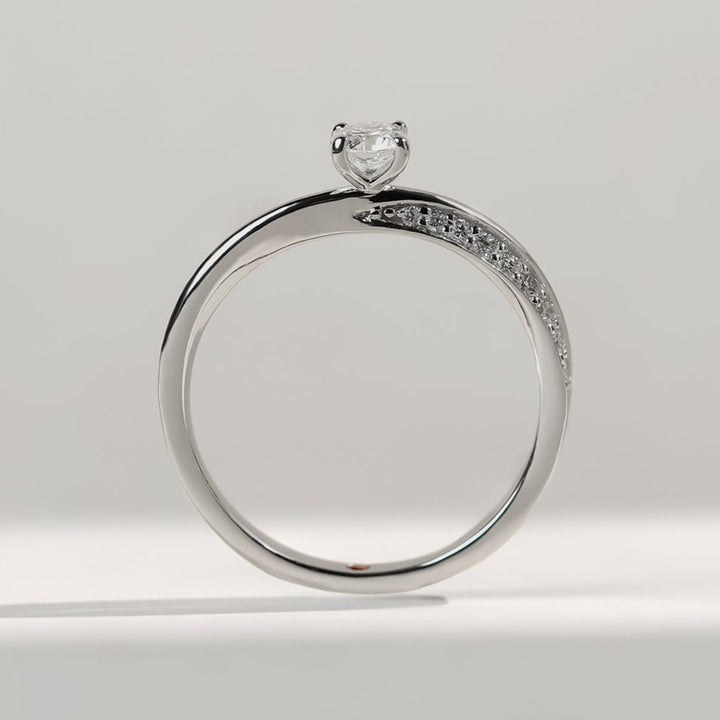 Side profile of Vow To Love Promise Ring with solitaire center diamond and pavé-set detailing.