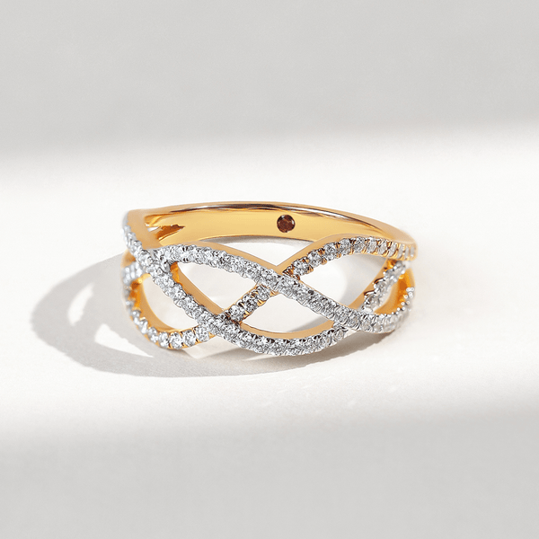 Close-up of Weaved In Dailywear Ring with crisscross diamond-studded bands in yellow gold.