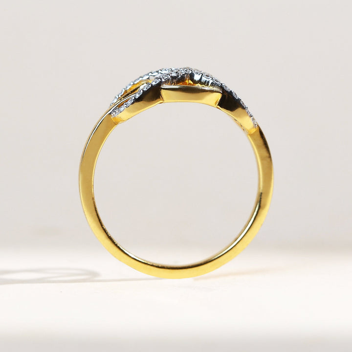 Side profile of Woven to Infinity ring in 18K yellow gold with pavé-set diamonds, sleek and symbolic.