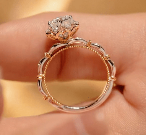Side profile showing the scalloped gallery with diamond-studded band
